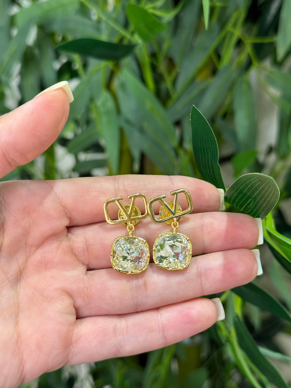 Orecchini V pendente diamante