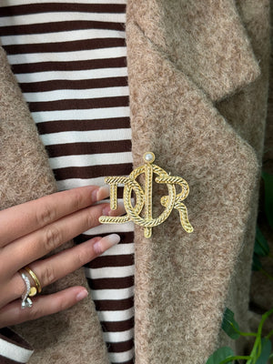 Spilla Dior martellata con perla