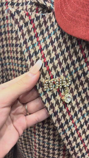 Spilla Miu Miu con goccia strassata